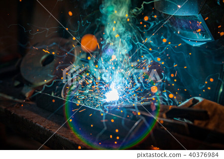 Welder in action. Low depth of focus 40376984