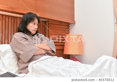 Angry wife waiting husband go back home in bedroom 40378012