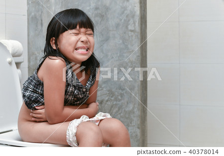 girl feel pain with constipation in the bathroom 40378014