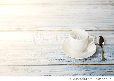 white coffe cup on light wooden background white coffe cup on light wooden background 40383596