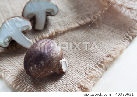 Raw and fresh mushrooms on sackcloth 40389631