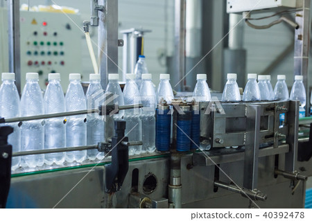Closeup on mineral water bottles in raw and lines Closeup on mineral water bottles in raw and lines 40392478
