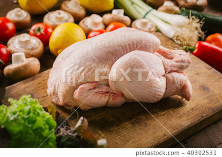 Fresh poultry chicken on wooden table Fresh poultry chicken on wooden table 40392531