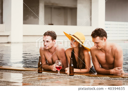 Young people having fun in swimming pool. Young people having fun in swimming pool. 40394635