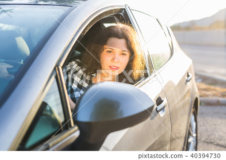 Beautiful young woman in the new car 40394730