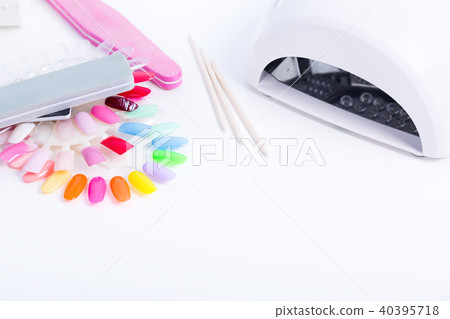 Nail LED lamp, colour gel polishes and pink file Nail LED lamp, colour gel polishes and pink file 40395718