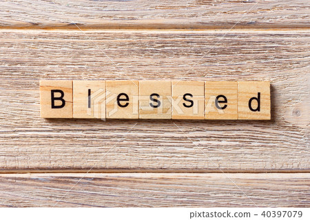 Blessed word written on wood block. 40397079