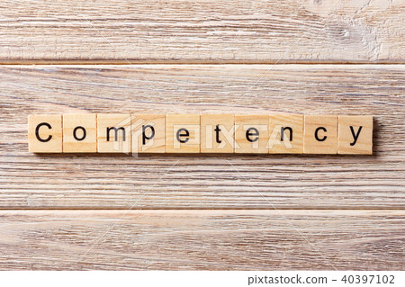 Competency word written on wood block. Competency word written on wood block. 40397102