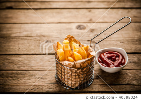 French fries on wooden table 40398024