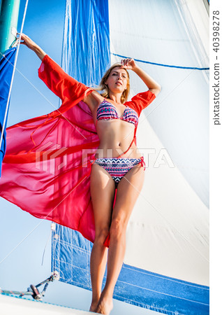 Beautiful bikini girl in open water sea on yacht Beautiful bikini girl in open water sea on yacht 40398278