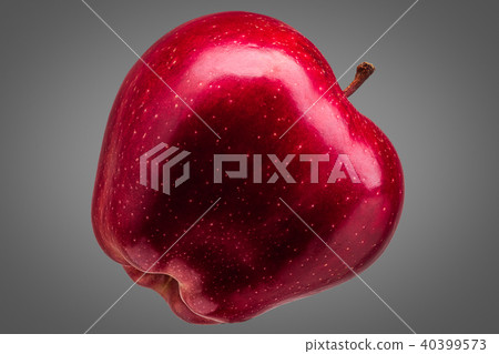 Single delicious red apple on grey background Single delicious red apple on grey background 40399573