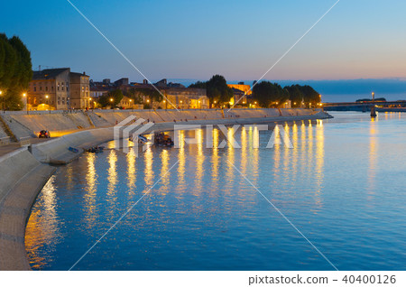 People walking embankment Arles, France 40400126