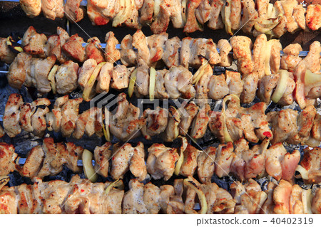 Cooked pork meat. Barbecue lunch. shashlik closeup Cooked pork meat. Barbecue lunch. shashlik closeup 40402319