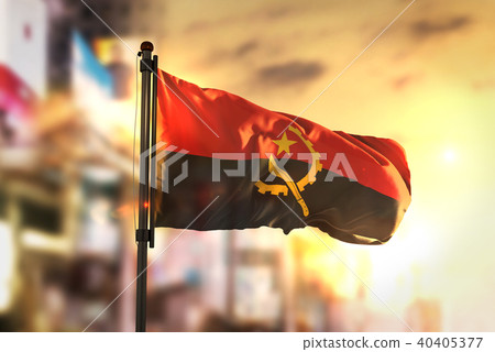 Angola Flag Against City Blurred Background 40405377