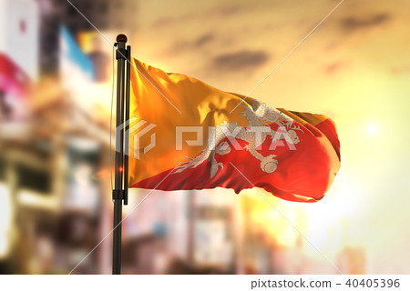 Bhutan Flag Against City Blurred Background 40405396