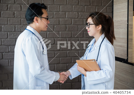 Doctor handshake and teamwork for achievement Doctor handshake and teamwork for achievement 40405734