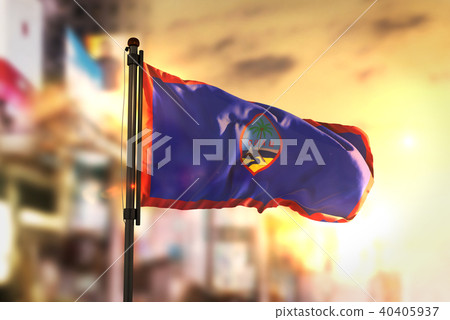 Guam Flag Against City Blurred Background Guam Flag Against City Blurred Background 40405937