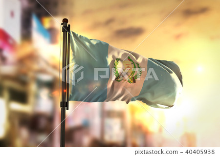 Guatemala Flag Against City Blurred Background 40405938