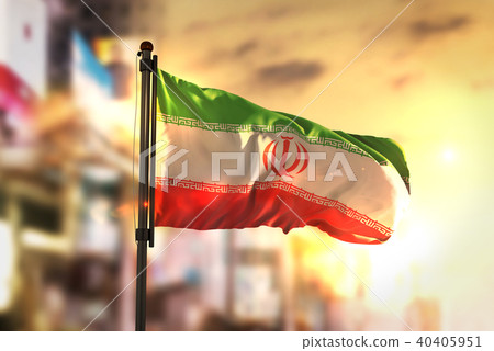Iran Flag Against City Blurred Background 40405951
