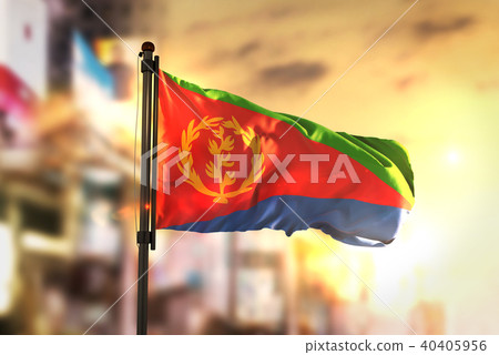 Eritrea Flag Against City Blurred Background Eritrea Flag Against City Blurred Background 40405956