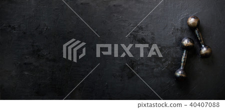 Old dumbbells on concrete background. Sport Old dumbbells on concrete background. Sport 40407088