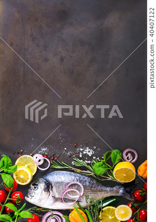 Fresh uncooked fish, dorado, sea bream with lemon Fresh uncooked fish, dorado, sea bream with lemon 40407122