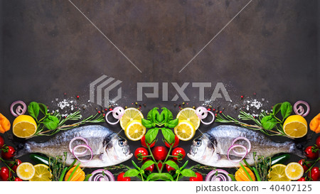 Fresh uncooked fish, dorado, sea bream with lemon Fresh uncooked fish, dorado, sea bream with lemon 40407125
