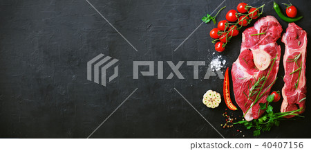 Raw meat steaks with cherry tomatoes, hot pepper Raw meat steaks with cherry tomatoes, hot pepper 40407156