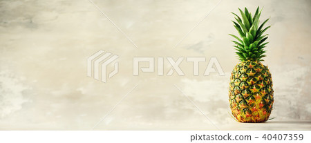 Tropical pineapples on gray background. Summer 40407359