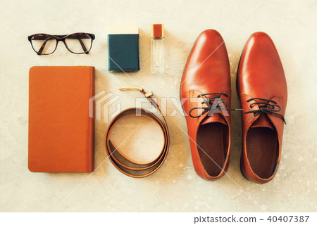 Men's accessories and shoes on gray background 40407387