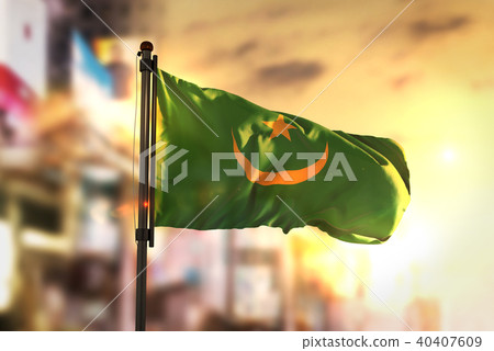 Mauritania Flag Against City Blurred Background 40407609