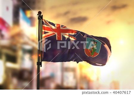 Montserrat Flag Against City Blurred Background 40407617