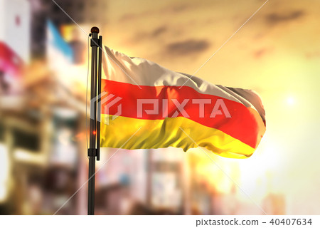 North Ossetia-Alania Flag Against City Blurred 40407634