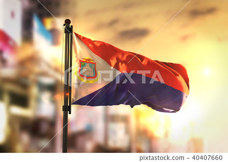 Saint Martin Flag Against City Blurred Background 40407660