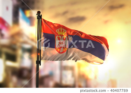 Serbia Flag Against City Blurred Background Serbia Flag Against City Blurred Background 40407789