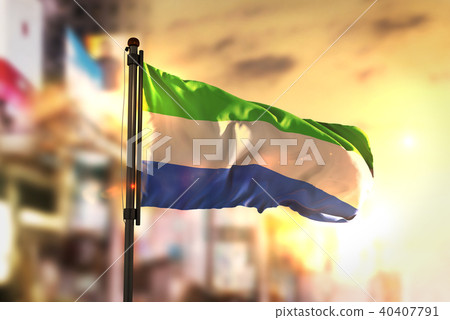 Sierra Leone Flag Against City Blurred Background Sierra Leone Flag Against City Blurred Background 40407791