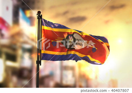 Swaziland Flag Against City Blurred Background 40407807