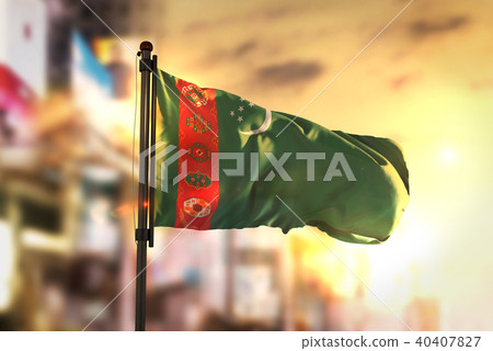Turkmenistan Flag Against City Blurred Background 40407827