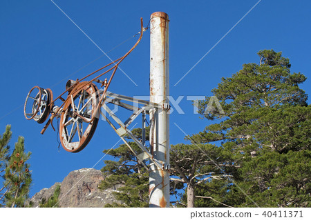 Old rusty pillar of an abandoned skilift in the Ese valley, Corsica, France Old rusty pillar of an abandoned skilift in the Ese valley, Corsica, France 40411371