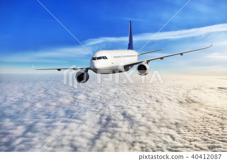 Passengers airplane flying above clouds 40412087