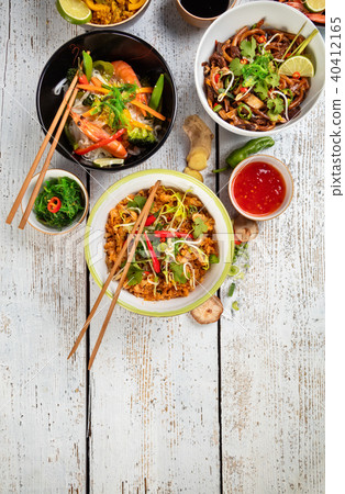 Asian food served on wooden table, top view, space for text 40412165