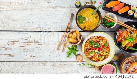 Asian food served on wooden table, top view, space for text 40412178