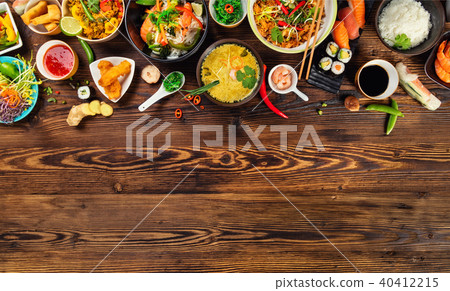 Asian food served on wooden table, top view, space for text 40412215