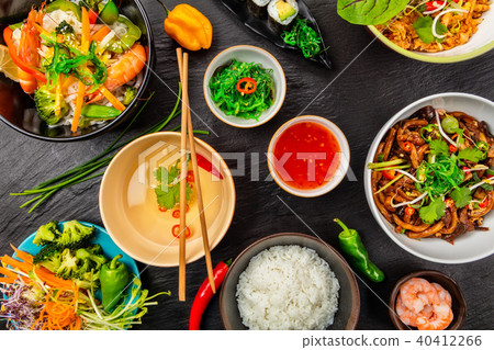 Asian food served on black stone, top view Asian food served on black stone, top view 40412266