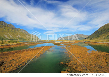 Mountain and fjord landscape, norwegian sea at Holandsmelen, Vestvagoy, Lofoten Islands, Norway Mountain and fjord landscape, norwegian sea at Holandsmelen, Vestvagoy, Lofoten Islands, Norway 40412360