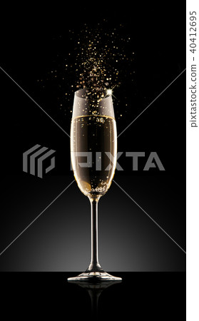 Glass of champagne on a black background. Glass of champagne on a black background. 40412695