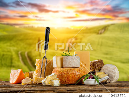 Various types of cheese placed on wooden table Various types of cheese placed on wooden table 40412751