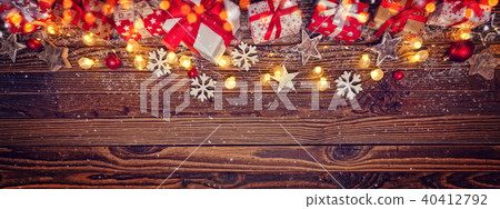 Christmas background with gifts and wooden decorations Christmas background with gifts and wooden decorations 40412792