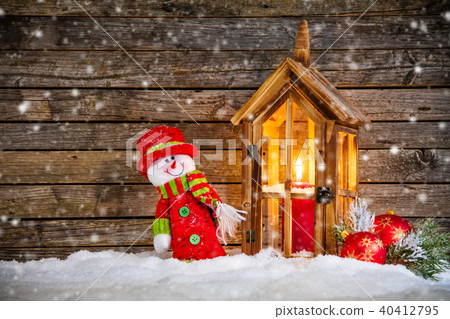 Burning lantern and christmas decoration on wood Burning lantern and christmas decoration on wood 40412795