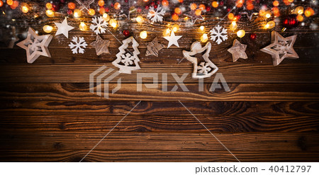 Christmas background with wooden decorations and spot lights. Christmas background with wooden decorations and spot lights. 40412797